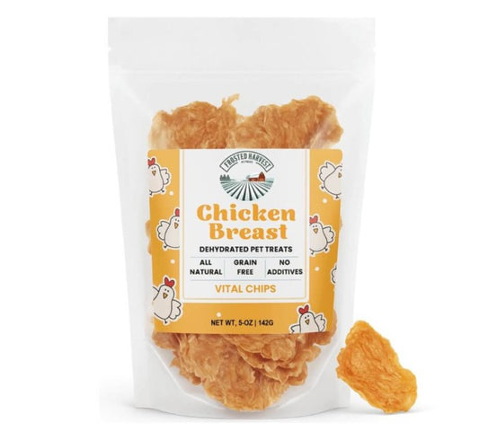 Package of dehydrated chicken breast pet treats with a visible brand label on a white background.